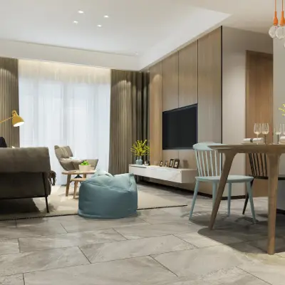 Modern living room featuring a gray sofa, light wood accents, a dining table set, and a bright atmosphere with large windows Modern living room featuring a gray sofa, light wood accents, a dining table set, and a bright atmosphere with large windows